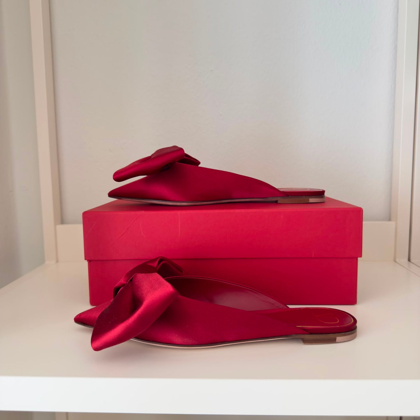 Valentino Mules flat con fiocco in rosso