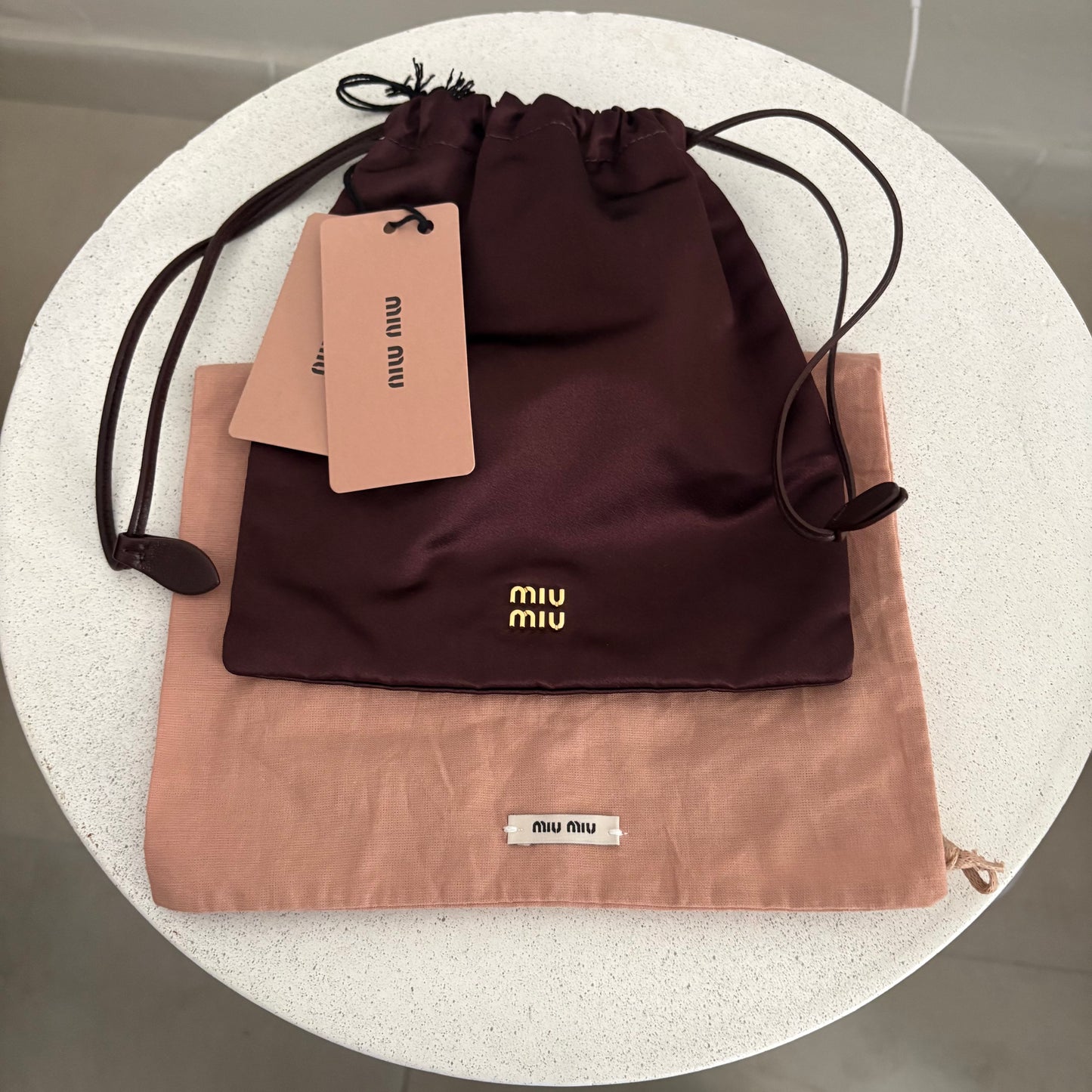 Miu Miu Pochette bordeaux in tessuto