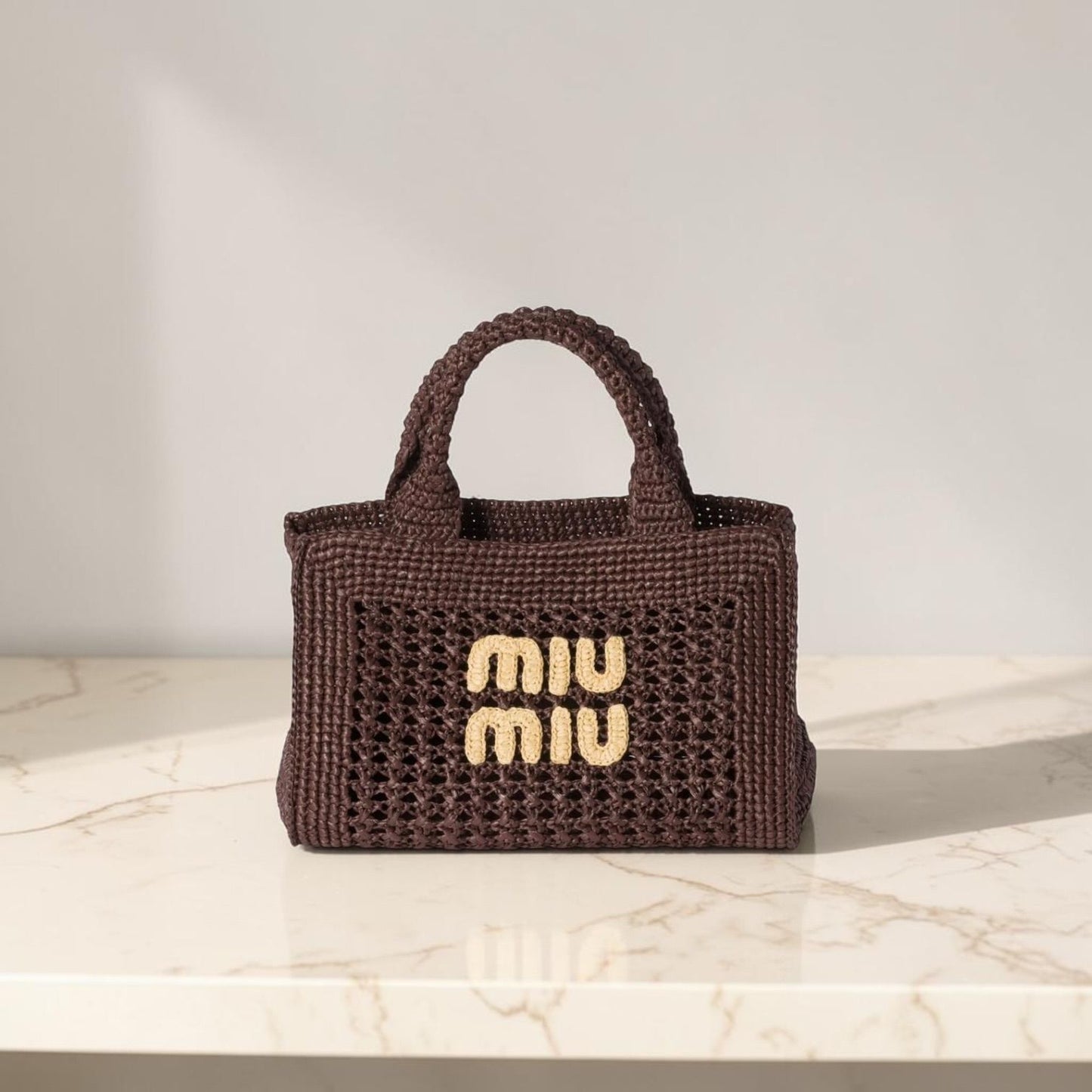 Miu Miu Borsa a mano effetto rafia intrecciata