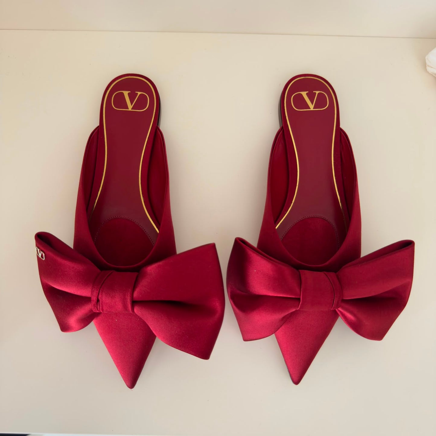 Valentino Mules flat con fiocco in rosso