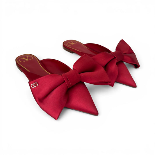 Valentino Mules flat con fiocco in rosso
