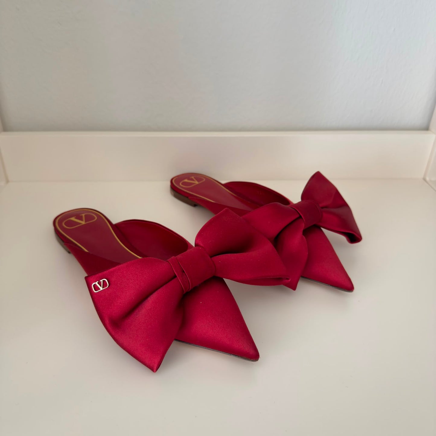 Valentino Mules flat con fiocco in rosso