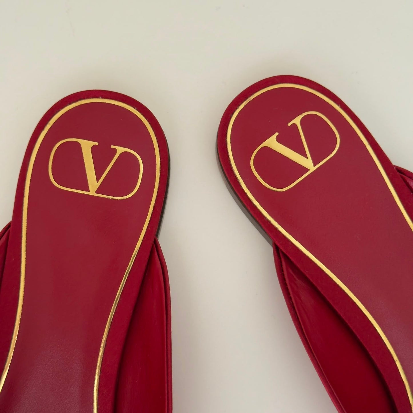 Valentino Mules flat con fiocco in rosso