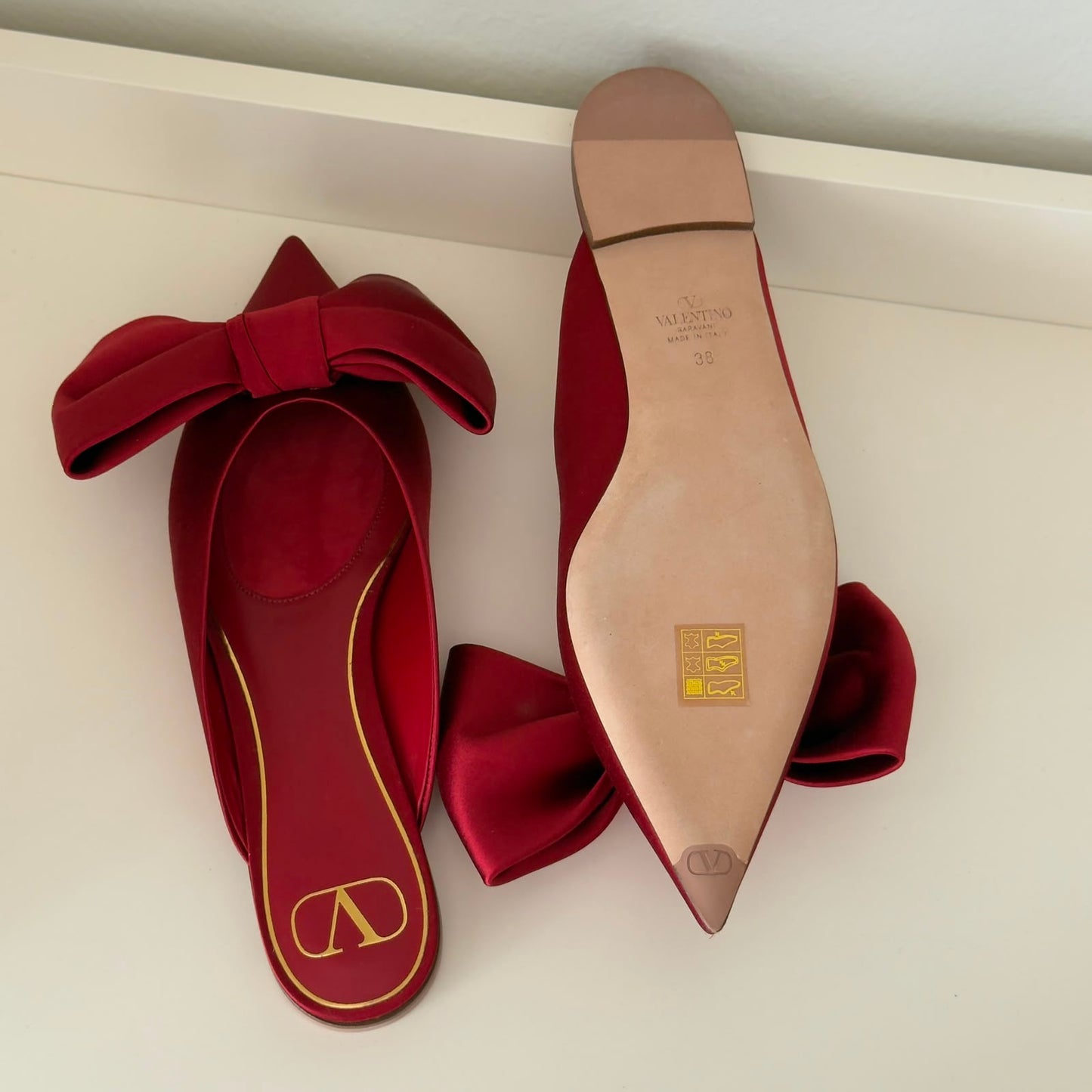 Valentino Mules flat con fiocco in rosso