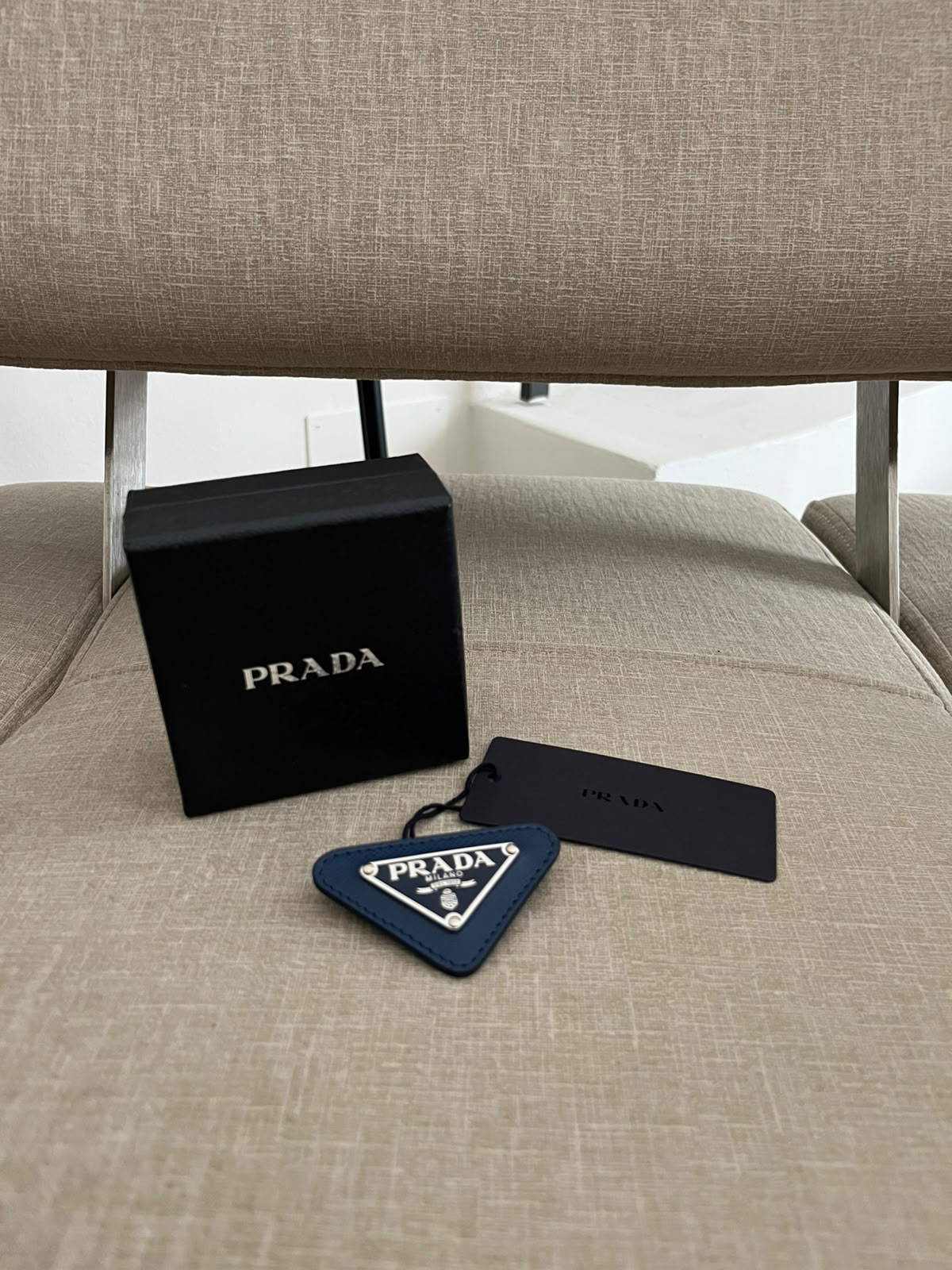Prada spilla triangle logo
