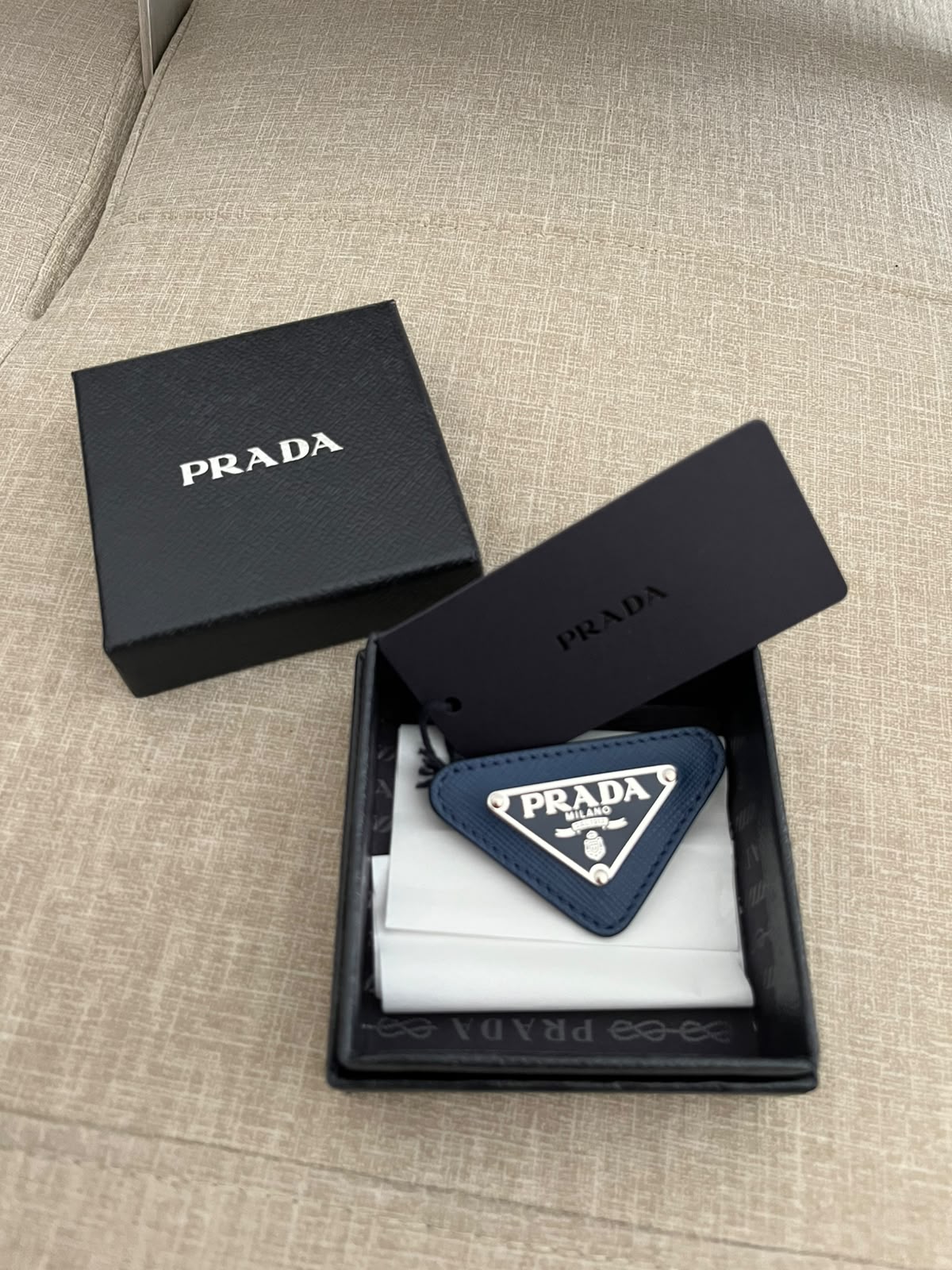 Prada spilla triangle logo