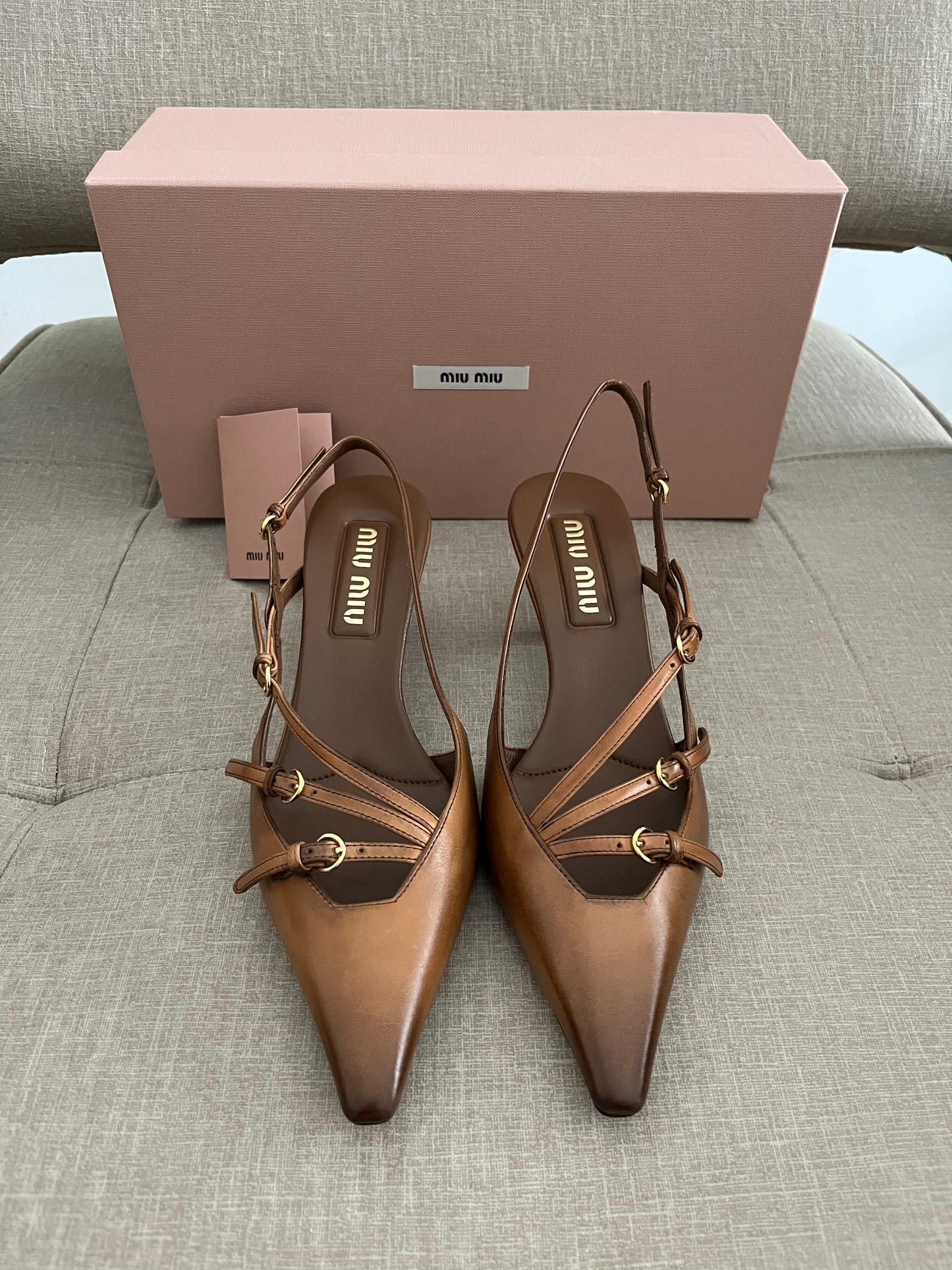 Sand patent slingback pumps