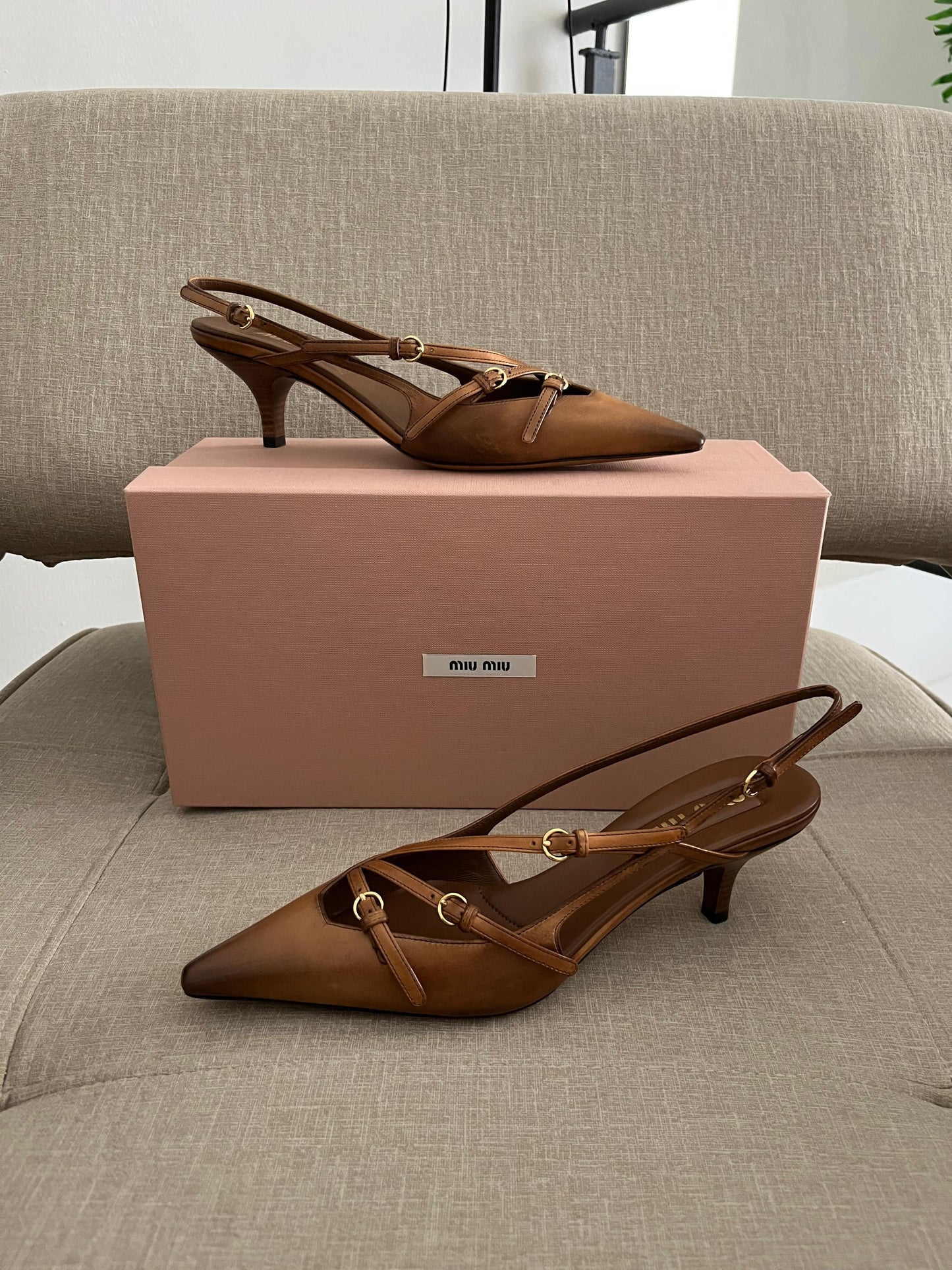 Sand patent slingback pumps