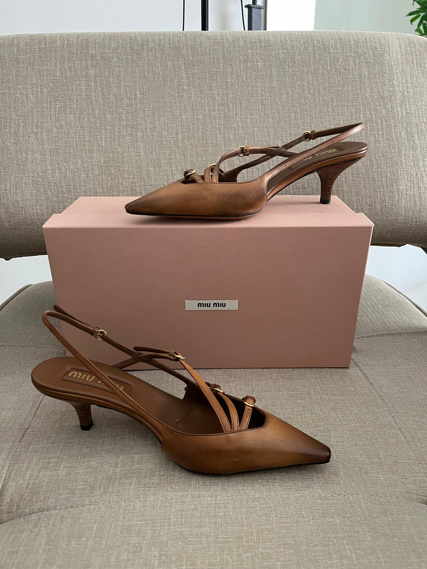 Sand patent slingback pumps