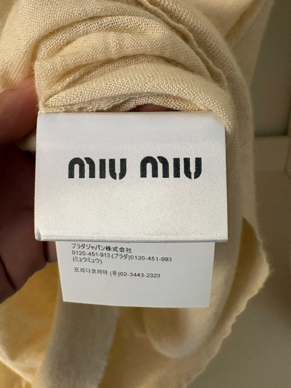 Miu Miu polo in maglia color avorio